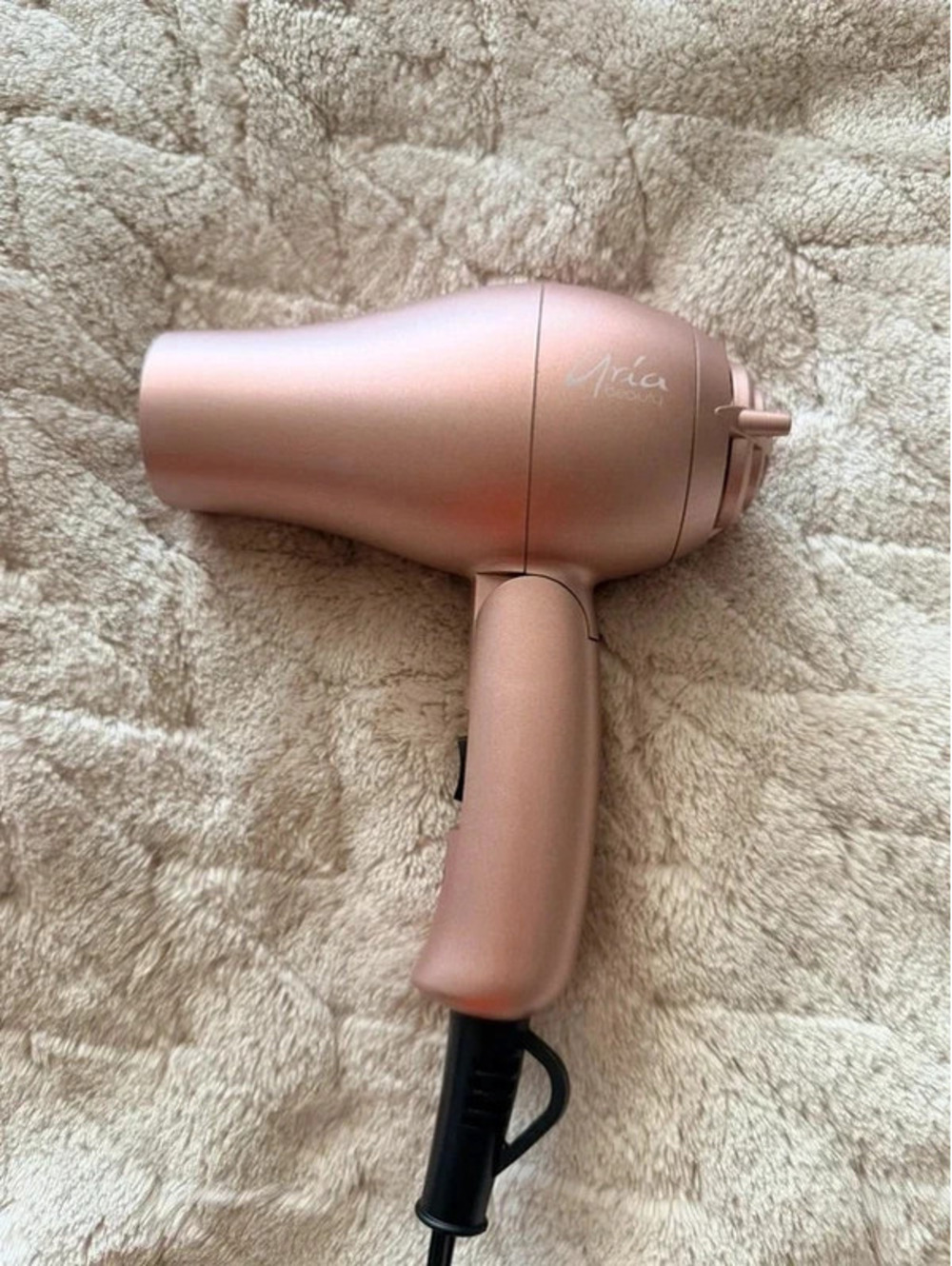 Small pink foldable travel hairdryer